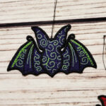 Swirly autumn bat lace hanging gothic halloween decoration.
