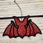 Swirly autumn bat lace hanging gothic halloween decoration.