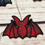 Swirly autumn bat lace hanging gothic halloween decoration.