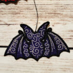 Swirly autumn bat lace hanging gothic halloween decoration.