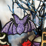Swirly autumn bat lace hanging gothic halloween decoration.