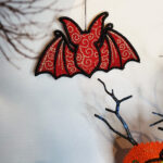 Swirly autumn bat lace hanging gothic halloween decoration.