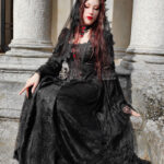 Model Hekate wears the Belladonna Court Black Brocade Gothic Victorian Prom Dress and mourning veil