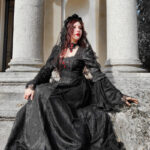 Model Hekate wears the Belladonna Court Black Brocade Gothic Victorian Prom Dress and mourning veil
