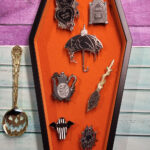 Orange velvet trinket box and gothic enamel pins