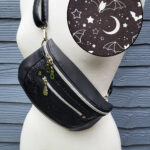 Clamshell Black Floral Vinyl Sling Crossbody Bag with Bats Lining