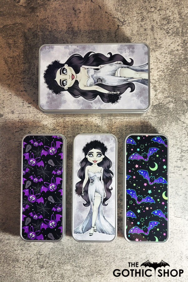 Gothic print tins with zombie bride and purple bats.