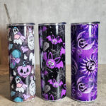 Purple gothic print tumblers including ghosts, bats and skull moons and sun.