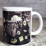 Spooky Halloween Village Scene Glow in the Dark Ceramic Mug