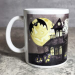 Spooky Halloween Village Scene Glow in the Dark Ceramic Mug