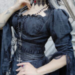 Gothic model Hekate wears the Lucretia Chains & Cross Black Lace Choker with Ruby Red Cabochon and Sinistra Ring