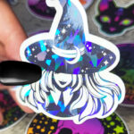 Smiling Young Witch with Moon Hat Black/White Gothic Glossy Sticker