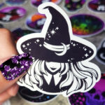 Smiling Young Witch with Moon Hat Black/White Gothic Glossy Sticker