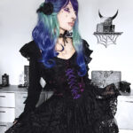 Goth model Valentinescorpse wears the Dark in Love Oriana Purple Velvet Black Lace Gothic Lolita Mini Dress.