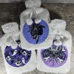 Gothic and halloween print Hot water bottles with plush covers.