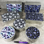 Gothic print round and rectangular tins for your keepsakes.