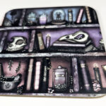 witchy curios rustic grungy colours bookshelves square glossy coaster