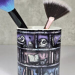witchy curios rustic grungy grey bookshelves pen or makeup brush pot