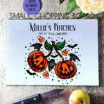 personalised halloween pumpkin cherries glass chopping board or worktop protector gift