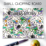 personalised spooky but sweet halloween glass chopping board or worktop protector gift