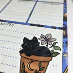 personalised bellatrix mystical black cat garden witchy weekly planner whiteboard metal sign