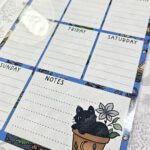 personalised bellatrix mystical black cat garden witchy weekly planner whiteboard metal sign