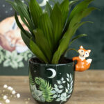 green forest plant pot with fox